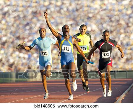 Relay racer crossing finish line on track in race View Large Photo Image Stock Photography - Relay racer crossing finish line on track in race. Fotosearch