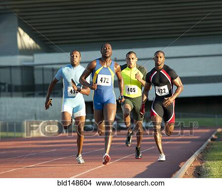 Relay racers running on track in race View Large Photo Image Picture - Relay racers running on track in race. Fotosearch