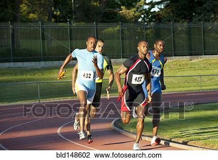 Relay racers running on track in race View Large Photo Image Stock Image - Relay racers running on track in race. Fotosearch
