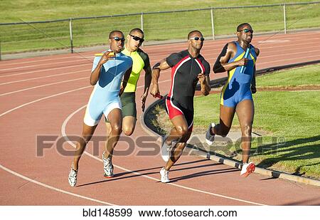 Stock Photo - Relay racers running on track in race. Fotosearch