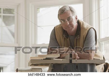 Serious Caucasian carpenter View Large Photo Image Stock Image - Serious Caucasian carpenter. Fotosearch