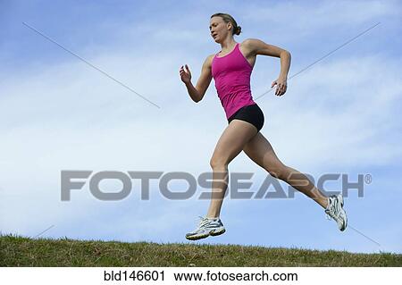 Serious Caucasian woman running View Large Photo Image Stock Image - Serious Caucasian woman running. Fotosearch