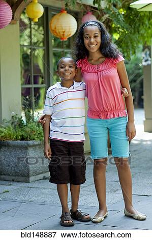 Smiling African American brother and sister View Large Photo Image Stock Photo - Smiling African American brother and sister. Fotosearch