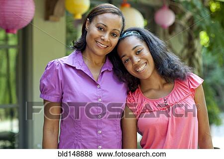 Stock Photo - Smiling African American mother and daughter. Fotosearch