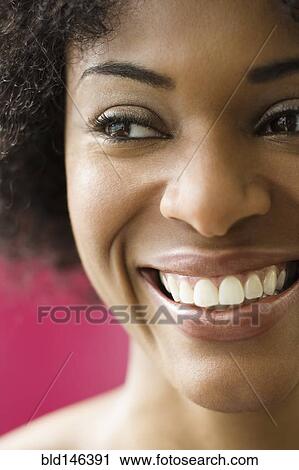 Stock Image - Smiling African American woman. Fotosearch