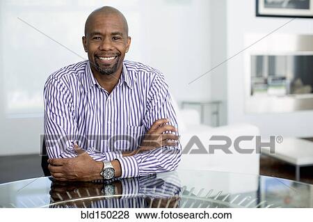 Stock Photo - Smiling Black businessman. Fotosearch