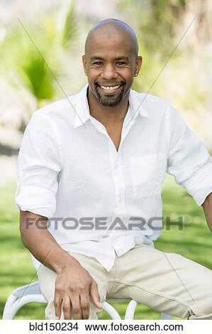 Picture - Smiling Black man. Fotosearch