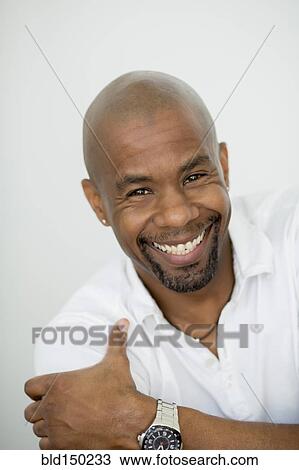 Stock Image - Smiling Black man. Fotosearch