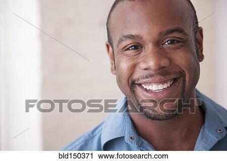 Stock Image - Smiling Black man. Fotosearch