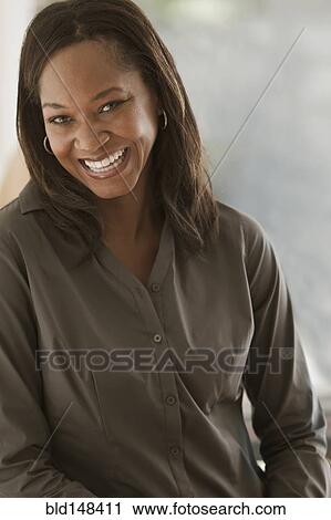 Stock Image - Smiling Black woman. Fotosearch