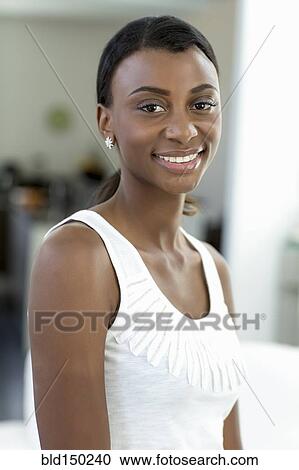 Stock Image - Smiling Black woman. Fotosearch