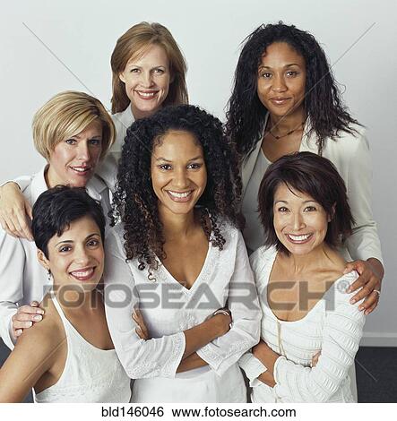 Stock Photograph - Smiling businesswomen dressed in white. Fotosearch