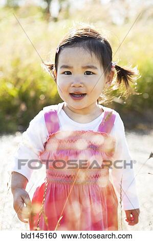 Stock Image - Smiling Chinese girl. Fotosearch