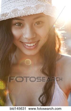 Smiling Chinese woman in hat View Large Photo Image Stock Image - Smiling Chinese woman in hat. Fotosearch