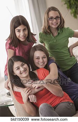 Smiling friends hugging View Large Photo Image Stock Photo - Smiling friends hugging. Fotosearch