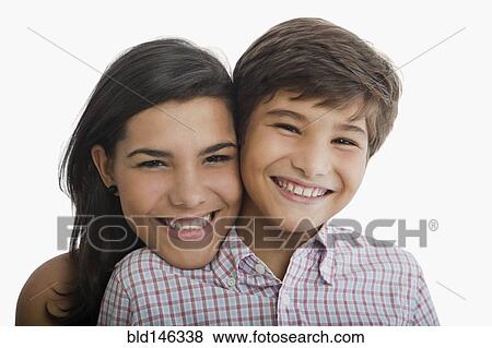 Smiling Hispanic brother and sister View Large Photo Image Stock Photo - Smiling Hispanic brother and sister. Fotosearch