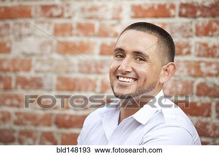 Stock Image - Smiling Hispanic man. Fotosearch
