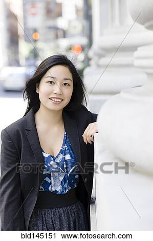 Stock Image - Smiling Japanese businesswoman. Fotosearch