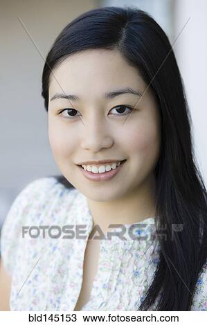 Stock Image - Smiling Japanese woman. Fotosearch