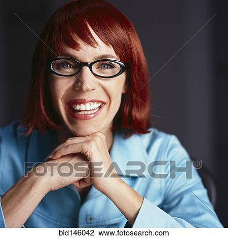 Smiling redheaded, mixed race businesswoman View Large Photo Image Stock Image - Smiling redheaded, mixed race businesswoman. Fotosearch