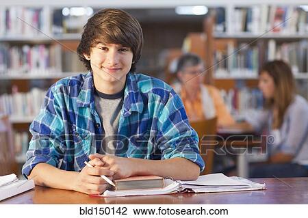 Smiling student in library View Large Photo Image Stock Image - Smiling student in library. Fotosearch