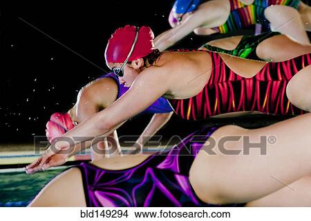 Swimmers diving off starting blocks View Large Photo Image Picture - Swimmers diving off starting blocks. Fotosearch