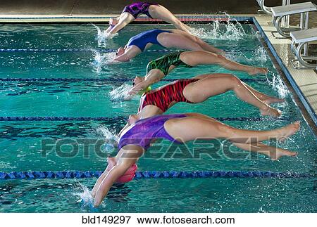 Swimmers diving off starting blocks View Large Photo Image Stock Photo - Swimmers diving off starting blocks. Fotosearch
