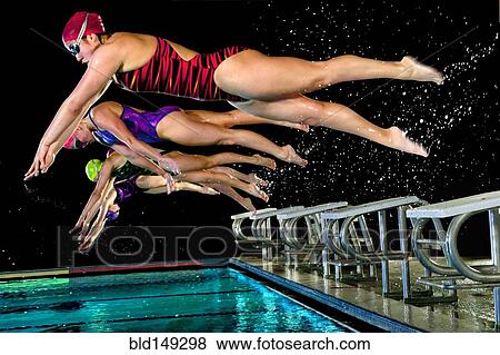 Swimmers diving off starting blocks View Large Photo Image Stock Photo - Swimmers diving off starting blocks. Fotosearch