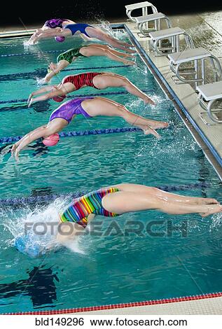 Swimmers diving off starting blocks View Large Photo Image Stock Photograph - Swimmers diving off starting blocks. Fotosearch