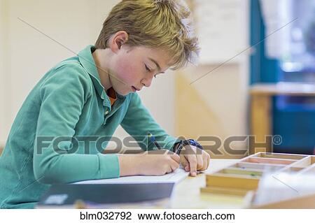Caucasian boy writing in classroom View Large Photo Image Stock Image - Caucasian boy writing in classroom. Fotosearch