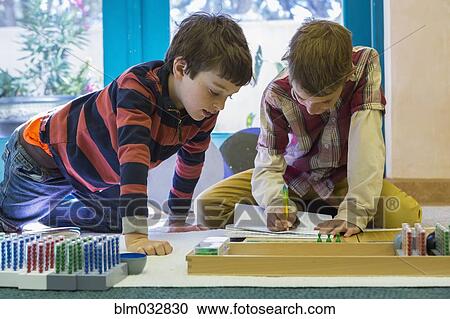 Caucasian boys working together in classroom View Large Photo Image Stock Image - Caucasian boys working together in classroom. Fotosearch
