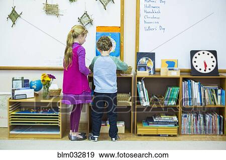 Caucasian children standing in classroom View Large Photo Image Stock Photo - Caucasian children standing in classroom. Fotosearch