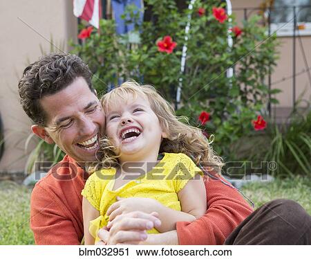 Caucasian father and daughter playing in backyard View Large Photo Image Stock Image - Caucasian father and daughter playing in backyard. Fotosearch