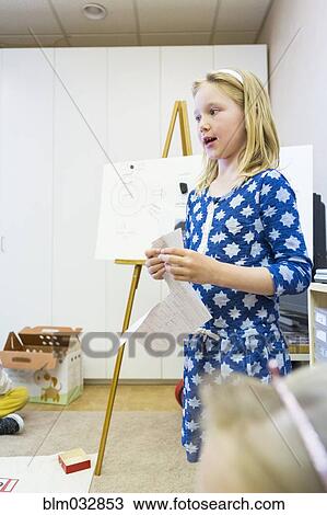 Caucasian girl giving presentation to classmates View Large Photo Image Stock Image - Caucasian girl giving presentation to classmates. Fotosearch