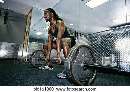 African American man lifting weights in gym View Large Photo Image Stock Image - African American man lifting weights in gym. Fotosearch