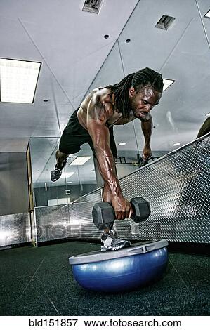 African American man lifting weights in gym View Large Photo Image Stock Photo - African American man lifting weights in gym. Fotosearch