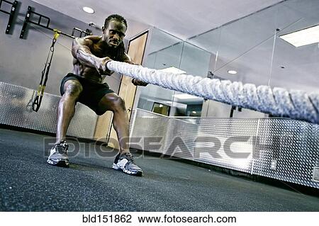 African American man working out with rope in gym View Large Photo Image Stock Image - African American man working out with rope in gym. Fotosearch
