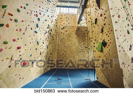 Belay ropes hanging near indoor rock wall View Large Photo Image Stock Image - Belay ropes hanging near indoor rock wall. Fotosearch