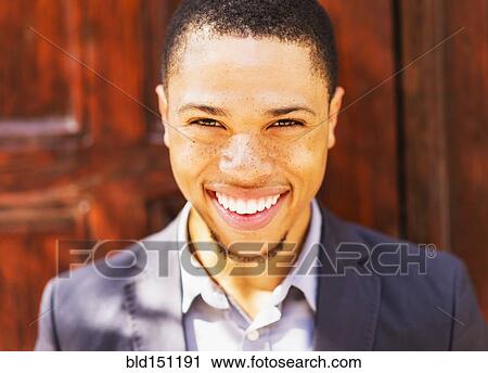 Black businessman smiling outdoors View Large Photo Image Stock Image - Black businessman smiling outdoors. Fotosearch