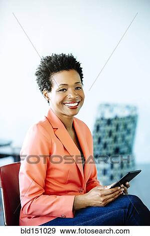 Black businesswoman using digital tablet View Large Photo Image Stock Photo - Black businesswoman using digital tablet. Fotosearch