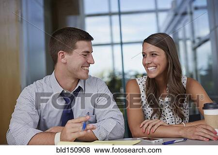 Business people laughing in office meeting View Large Photo Image Stock Photo - Business people laughing in office meeting. Fotosearch