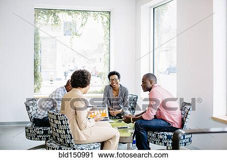 Business people talking in office lobby View Large Photo Image Stock Image - Business people talking in office lobby. Fotosearch