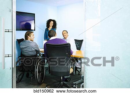 Business people talking in office meeting View Large Photo Image Stock Image - Business people talking in office meeting. Fotosearch