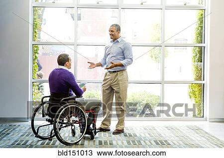 Businessmen talking in office View Large Photo Image Stock Image - Businessmen talking in office. Fotosearch
