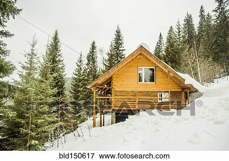 Stock Photo - Cabin on snowy remote hillside. Fotosearch