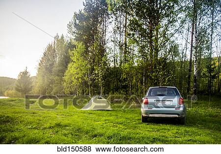 Car and tent at campsite in field View Large Photo Image Stock Photo - Car and tent at campsite in field. Fotosearch