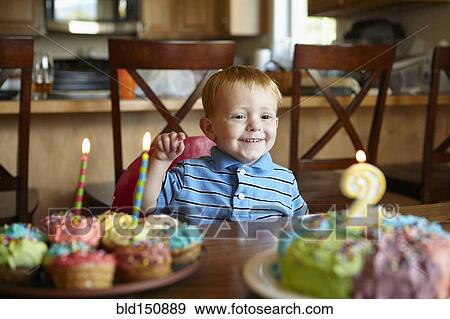 Caucasian boy admiring birthday cake View Large Photo Image Stock Photo - Caucasian boy admiring birthday cake. Fotosearch