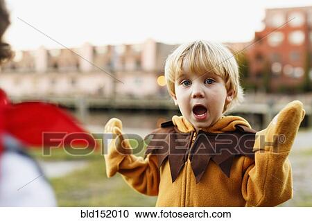 Caucasian boy playing in lion costume outdoors View Large Photo Image Stock Image - Caucasian boy playing in lion costume outdoors. Fotosearch