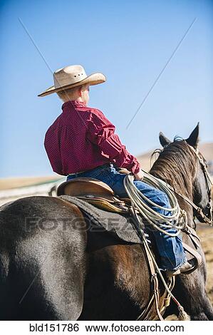 Caucasian boy riding horse View Large Photo Image Stock Photograph - Caucasian boy riding horse. Fotosearch