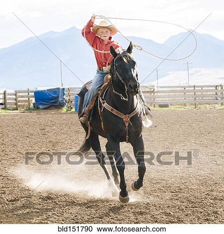 Caucasian boy using lasso on horse at rodeo View Large Photo Image Stock Image - Caucasian boy using lasso on horse at rodeo. Fotosearch